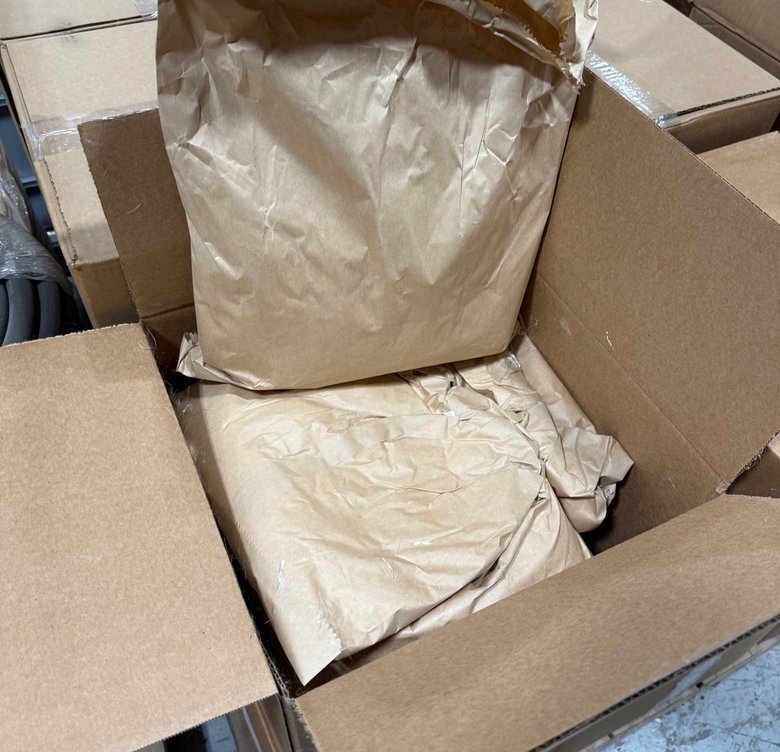 An open box of 5 lb Fortress fiber bags